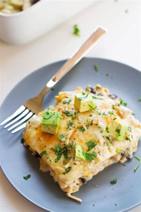 Once the chicken is cooked, layer your casserole. White Chicken Enchilada Casserole Recipe | Little Spice Jar