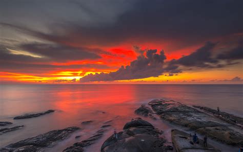 Red Sky Dark Clouds Reflection Sunset At The Coast Of Borneo Malaysia