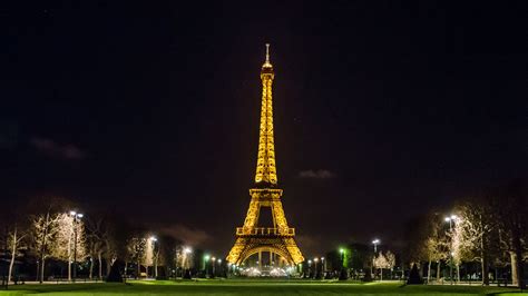 Paris Eiffel Tower With Yellow Lights With Dark Sky Background During