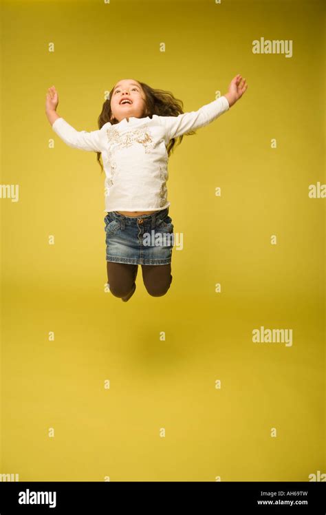 Little Girl Jumping Stock Photo Alamy