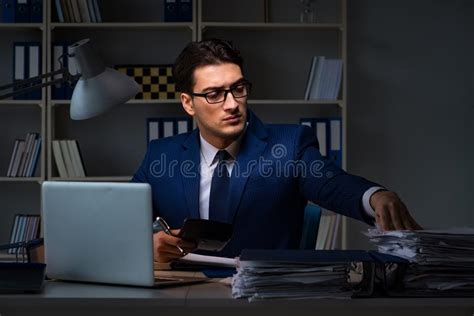 The Businessman Working Late At Night In Office For Overtime Bonus Stock Image Image Of