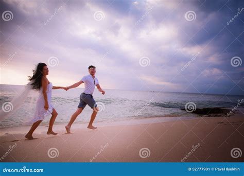 Couple Running At The Beach Stock Image Image Of Happy Female 52777901