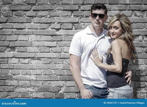 couple portrait in front of brick wall stock image image of standing fashion 34501727