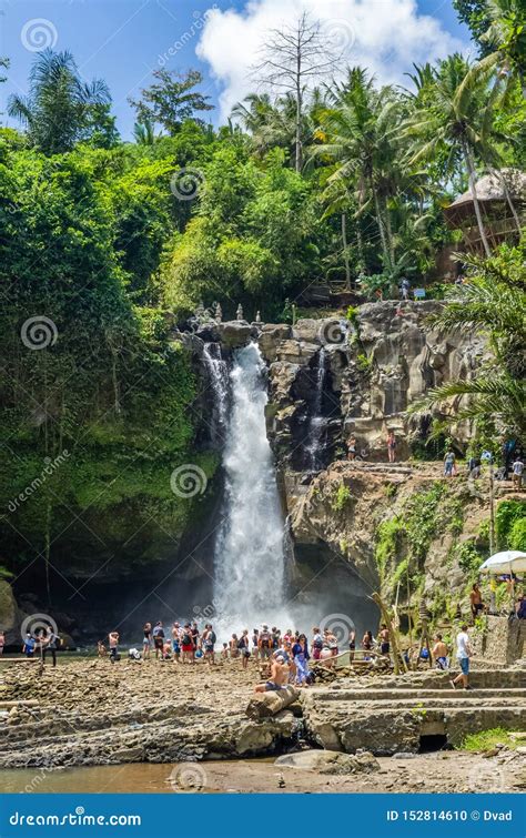 Tourists Swim In The Tegenungan Waterfall In Ubud Bali Indonesia