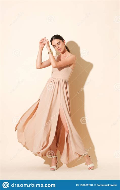 Attractive Model In Long Dress Posing In Studio Stock Photo Image Of