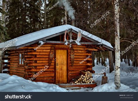A Remote Log Cabin During Winter In Alaskas Interior