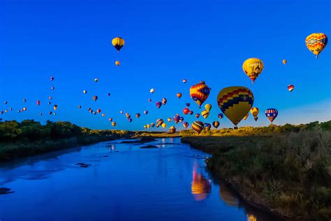 Hot Air Balloons Flying Low Over The Rio Grande River Just After