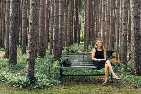 Female In Black Dress Sitting On A Bench In The Forest By Stocksy Contributor Gabi Bucataru