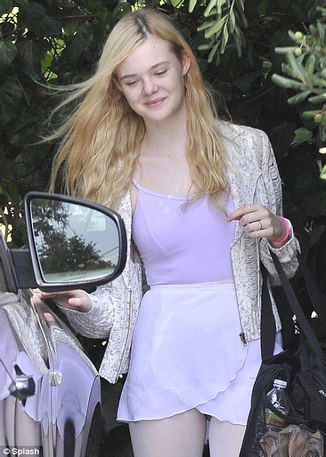 Elle Fanning Wears Thick Red Specs With Quirky Outfit Daily Mail Online