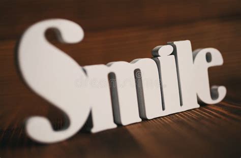 Word Smile And Motivation Concept Smile Text On Wooden Background