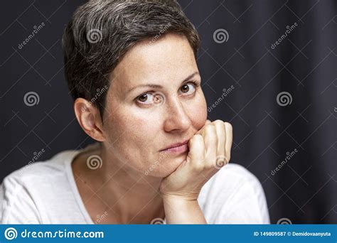 Pensive Adult Woman With Short Hair Portrait On A Black Background Stock Image Image Of