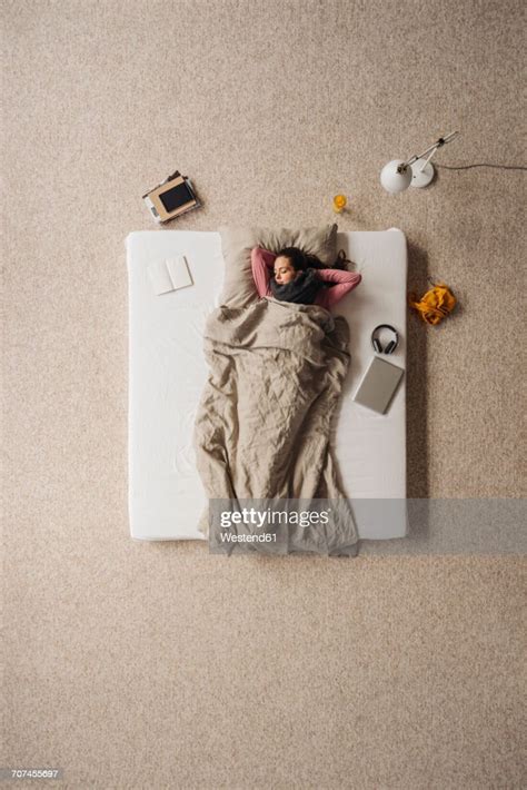 Woman Lying In Bed Top View Photo Getty Images