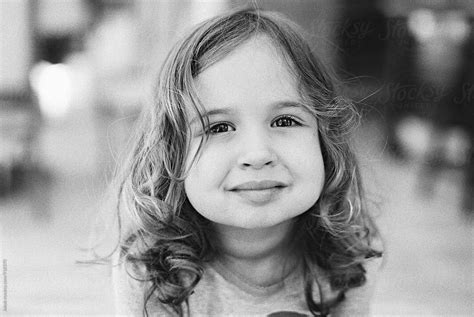 Black And White Portrait Of A Cute Young Girl With Big Cheeks By