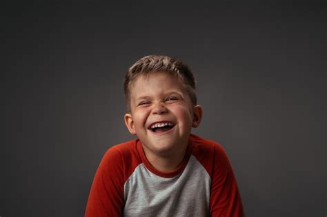 Premium Photo Funny Laughing Boy In Red Shirt With Eyes Shut Happy