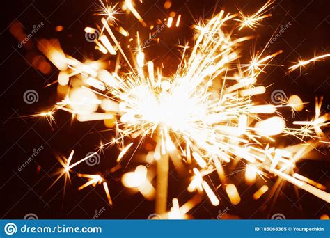 Close Up Of Golden Blurry Sparks Burn In The Dark Stock Image Image