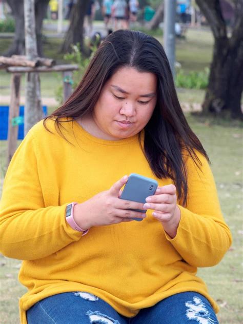 Portrait Fat Asian Woman Long Black Hair Wearing Yellow Shirt Are Using Mobile Phone Or