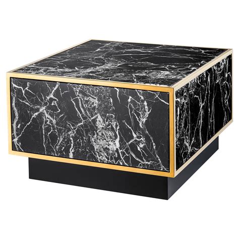 The coffee table has a white, marble tabletop and black, iron table base. Eichholtz Concordia Hollywood Regency Black Faux Marble Square Coffee Table