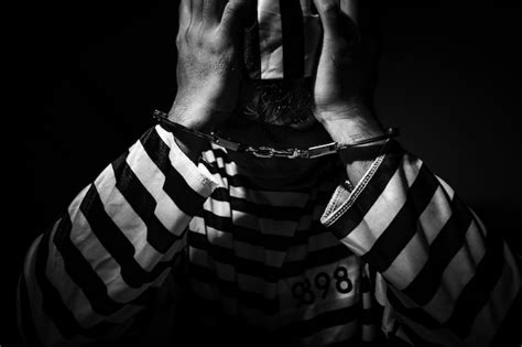Premium Photo Male Prisoner Sitting In Prison