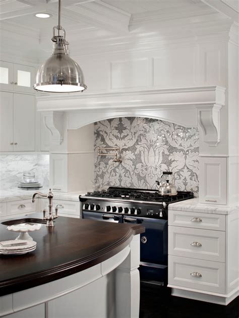 Gray beveled glass tiles on a cooktop backsplash add a glossy finish surrounded by white cabinets and white quartz countertops. Gray And White Backsplash | Houzz