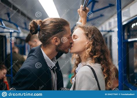 Man And A Woman In Love Kiss On A Subway Train Stock Image Image Of
