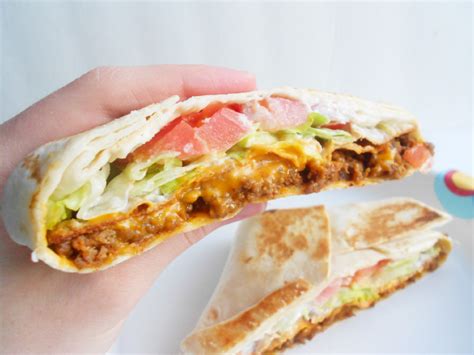 Ground meat (chicken or beef) seasoned with a homemade taco seasoning mix, layered up with cheese, peppers, crispy baked tostadas, and more! Homemade Crunchwrap Supreme · How To Cook A Wrap · Cooking ...