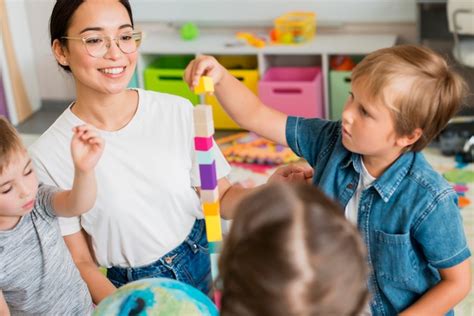 Free Photo Students Playing A Game With Their Kindergarten Teacher