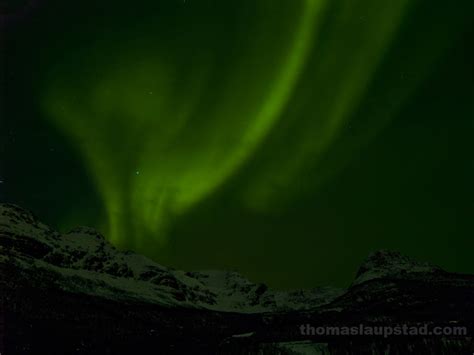 Picture Of Northern Lights Aurora Borealis Over Snow Clad Mountains