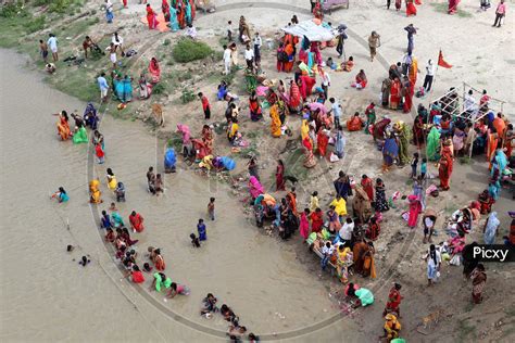 Image Of Hindu Women Devotees Take Holy Dip In The Ganga River On The Occasion Of Teej Festival