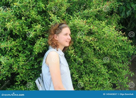 Girl In Front Of Green Bush Stock Image Image Of Female Green 149443837
