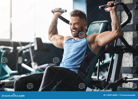 handsome muscular man working out hard at gym stock image image of abdominal handsome 149014085