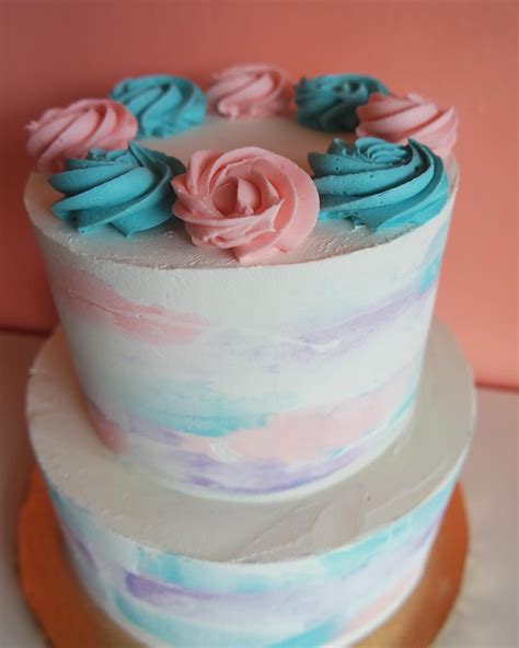 pastel pink blue and purple buttercream watercolor cake by 2tarts genderreveal customcake