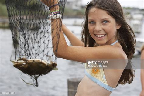 Girl Holding Fishing Net Containing Crab Closeup Portrait High Res