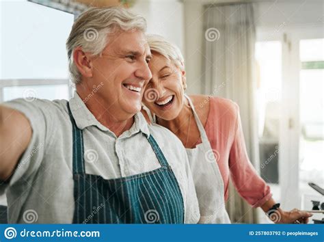 Elderly Couple And Selfie In Home Happy While Cooking Baking Or