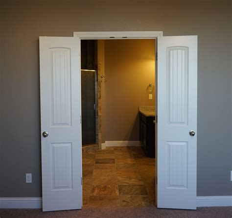 These doors are ideal for compact rooms to save space and allow better light and air into the room. Santa Fe double doors into master bath | New homes, Home ...