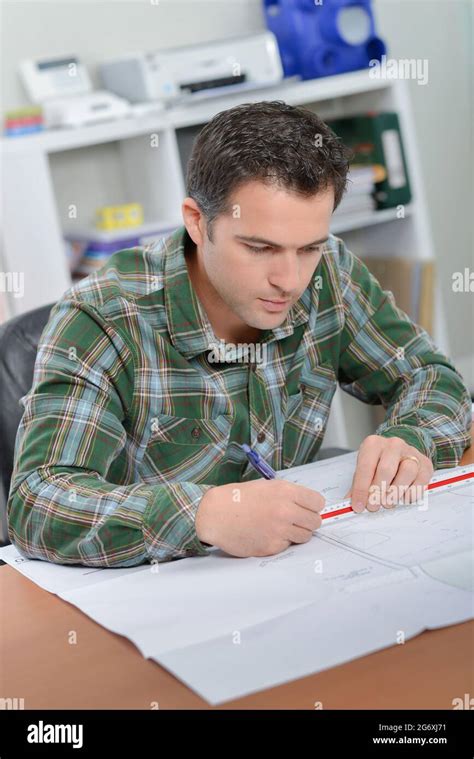 An Architect Drawing Up Plans Stock Photo Alamy