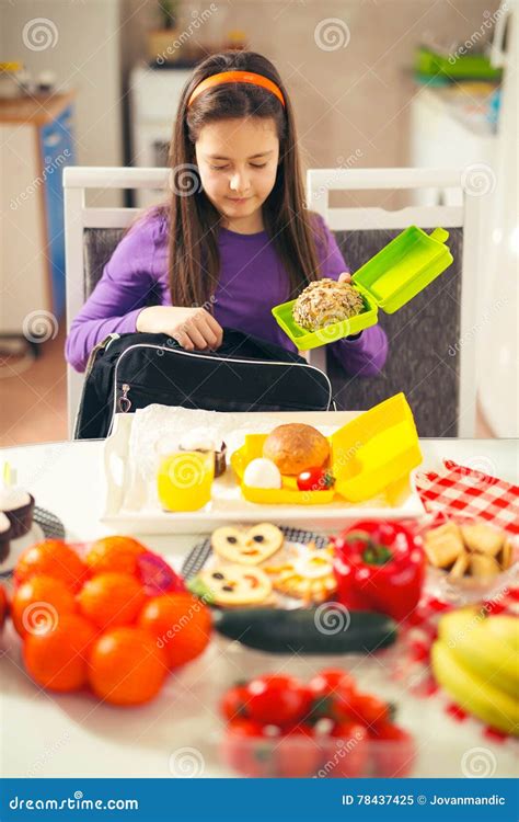 Girl Puts A Snack In A Bag For School Stock Image Image Of Kitchen