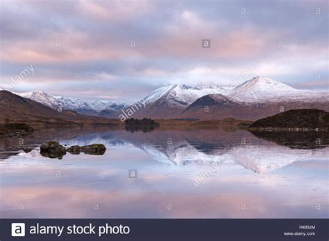 Frozen Lochan Na H Achlaise And Snow Covered Black Mount Mountain Range