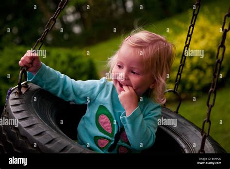 Little Girl Swing On Tire Hi Res Stock Photography And Images Alamy