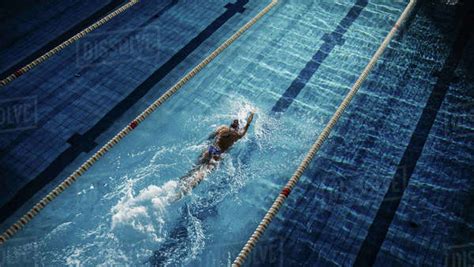 Female Swimmer Racing In Swimming Pool Professional Athlete Overcoming