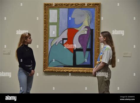 Employees pose during a press preview of ‘The EY Exhibition: Picasso