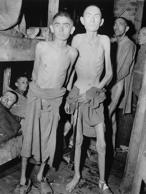 Emaciated Jewish Survivors Pose In A Barracks In The Newly Liberated