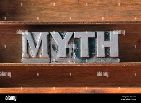 Myth Word Made From Metallic Letterpress Type On Wooden Tray Stock
