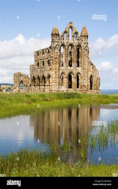 The Ruins Of Whitby Abbey Reflected In The Monastery Lake East Cliff