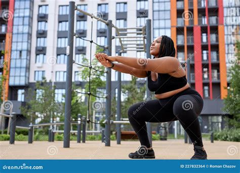 Overweight African Woman Is Engaged In Fitness On Sports Ground