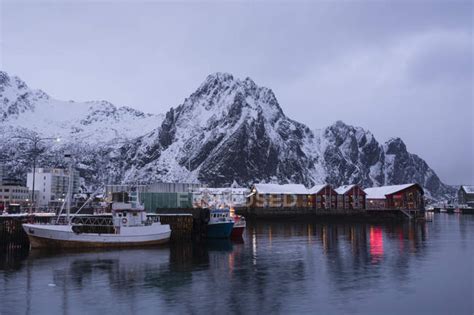 Waterfront Harbor And Fishing Boats At Dusk Svolvaer Lofoten Islands