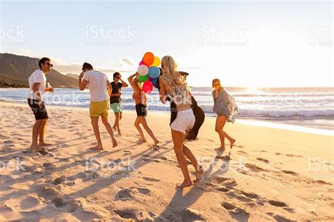 Young Fun Party People Having Fun On The Beach With Balloons Pls