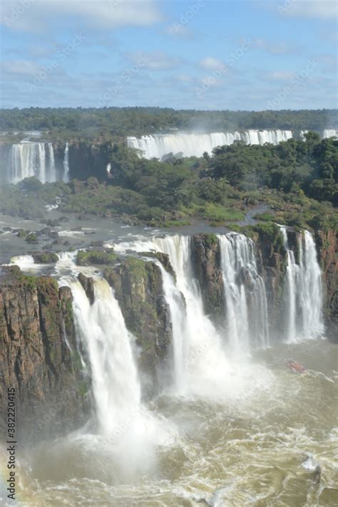 Rainbows Over The Mighty And Powerful Iguzu Iguacu Waterfalls Between