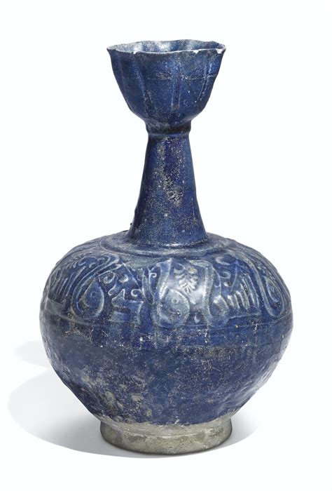 122 a kashan blue glazed moulded pottery bottle vase persia 12th century