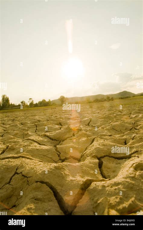 Sun Setting Over Arid Land Stock Photo Alamy