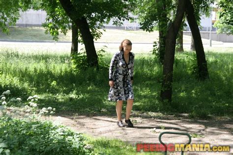 Black And White Outfit And Yellow Pee Stream Of A Skanky Park Pisser